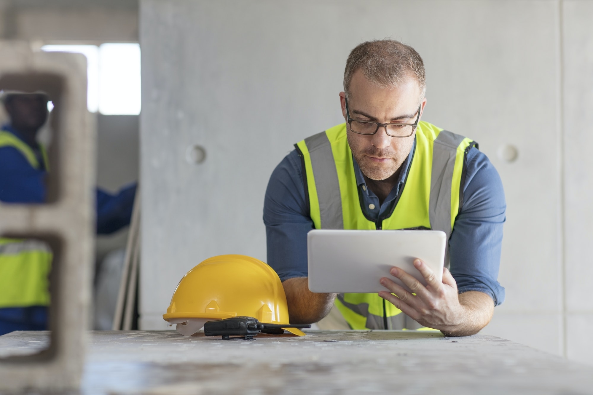 Architect using laptop at construction site